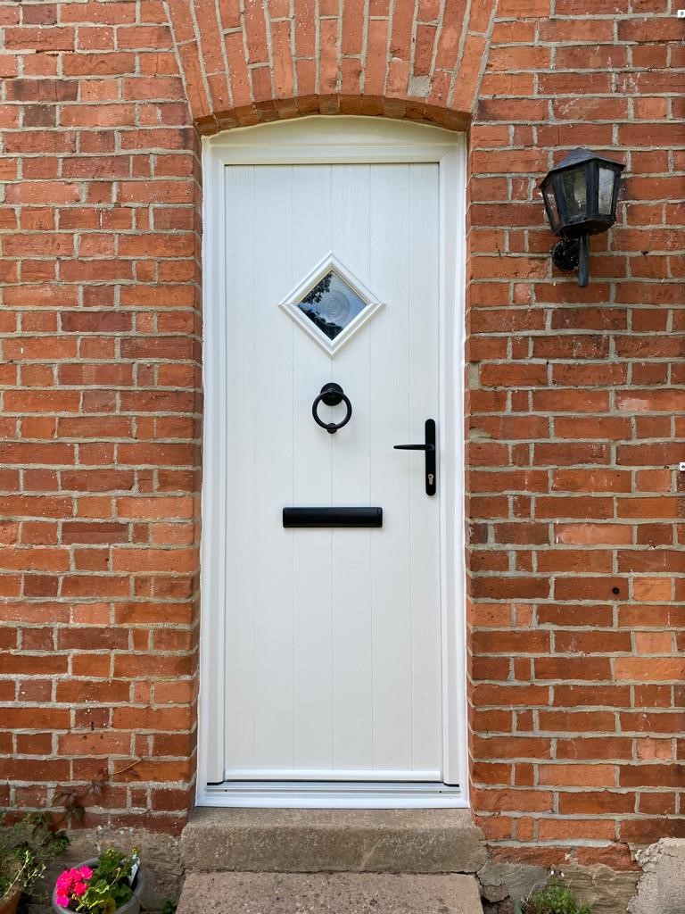 White Composite Door With Black Hardware